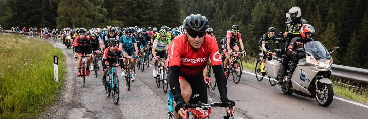 Take part in the Maratona dles Dolomites — one of the larges cycling events in the world